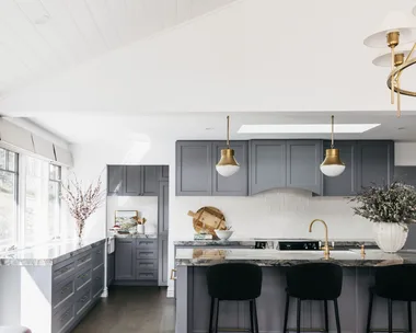 A grey blue kitchen inside a modern melbourne home.