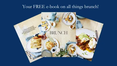 E-book cover with brunch dishes, including pancakes and avocado toast, on a wooden table. Text: "Your FREE e-book on brunch."