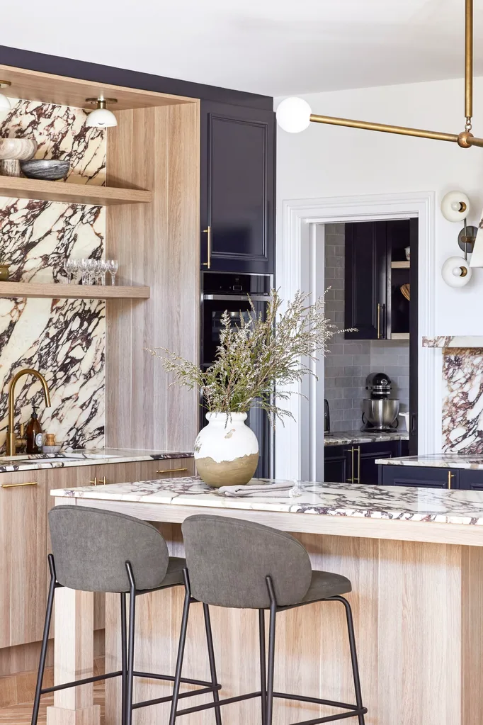 Californian bungalow renovation kitchen with calacatta viola marble and timber and navy cabinetry with a brass pendant light