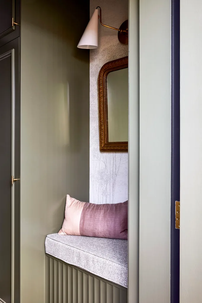 Californian bungalow renovation laundry mudroom with banquette seating and wallpaper with fluted cabinetry painted in green dulux mangrove
