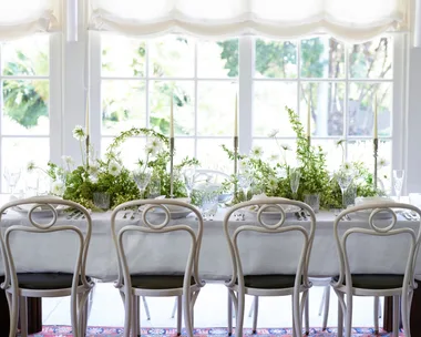 A white table with greenery in Chiswick restaurant
