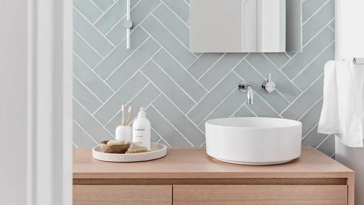 Coastal style bathroom with subway tile splashback and custom timber vanity