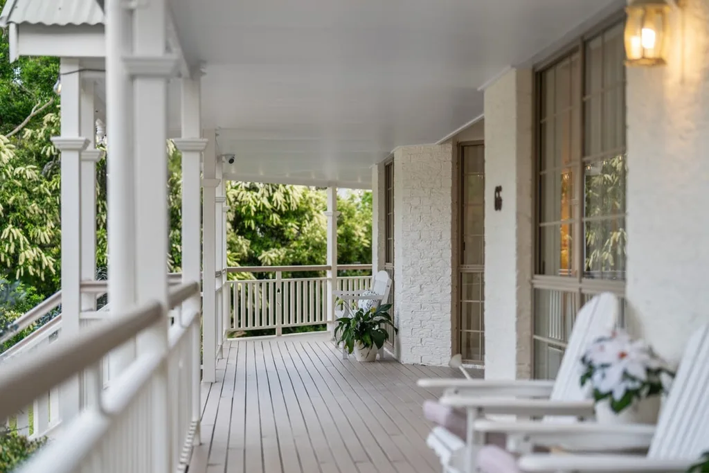 Corey Parker Daisy Hill home exterior cream paint with verandah chairs