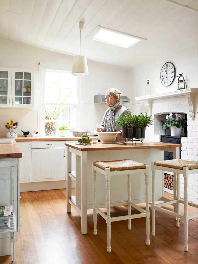 White and timber country style kitchen featuring Ikea cabinets.