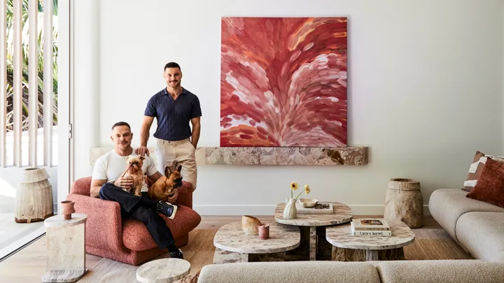 Darren Palmer with Olivier Duvillard and their dogs in the living room.