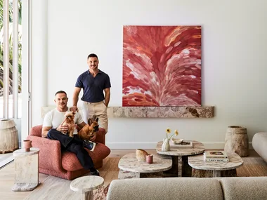 Darren Palmer with Olivier Duvillard and their dogs in the living room.
