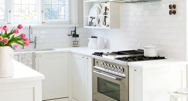 Hamptons-inspired style meets vintage charm in this lovingly restored kitchen