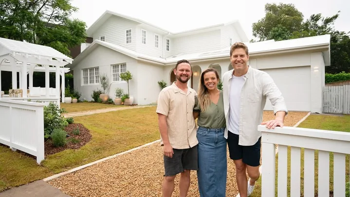 Lara and Peter Dream Home team with Dr Chris Brown outside their place