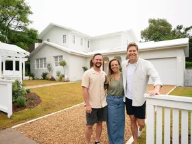 Lara and Peter Dream Home team with Dr Chris Brown outside their place