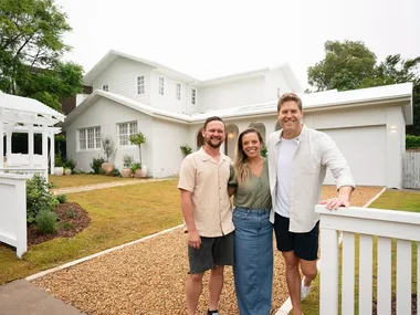 Lara and Peter Dream Home team with Dr Chris Brown outside their place