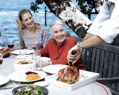 Margaret Fulton's classic French roast chicken recipe served with family