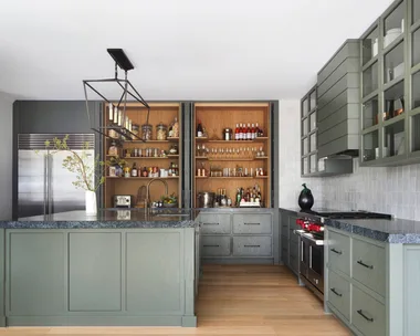 A modern farmhouse kitchen with greige cabinetry.