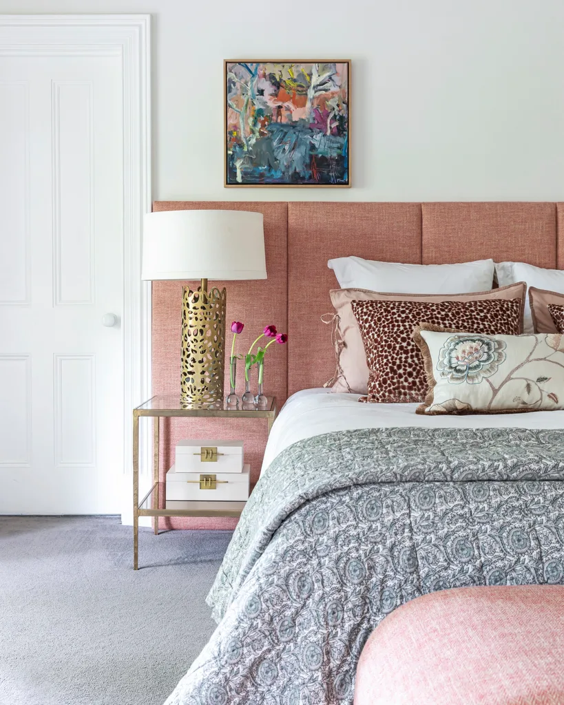 A main bedroom decorated with pink. 