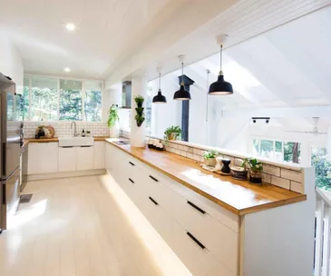 White and Scandi-style IKEA kitchen with timber bench top