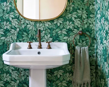 Green leaf wallpapered powder room ideas with pedestal basin