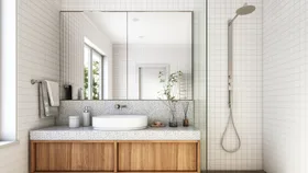 image of a white bathroom with natural wooden cabinets and a rain shower